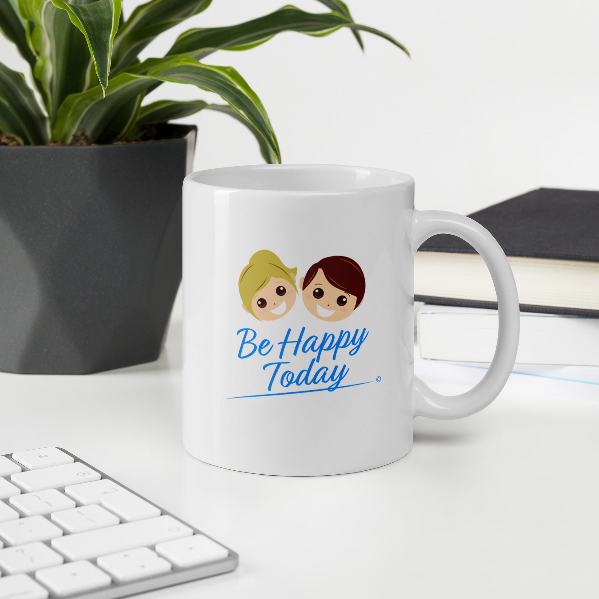 Glossy finish white coffee cups with a keyboard and green plant in the background